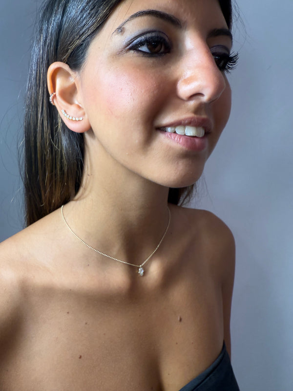 Collana con mano portafortuna